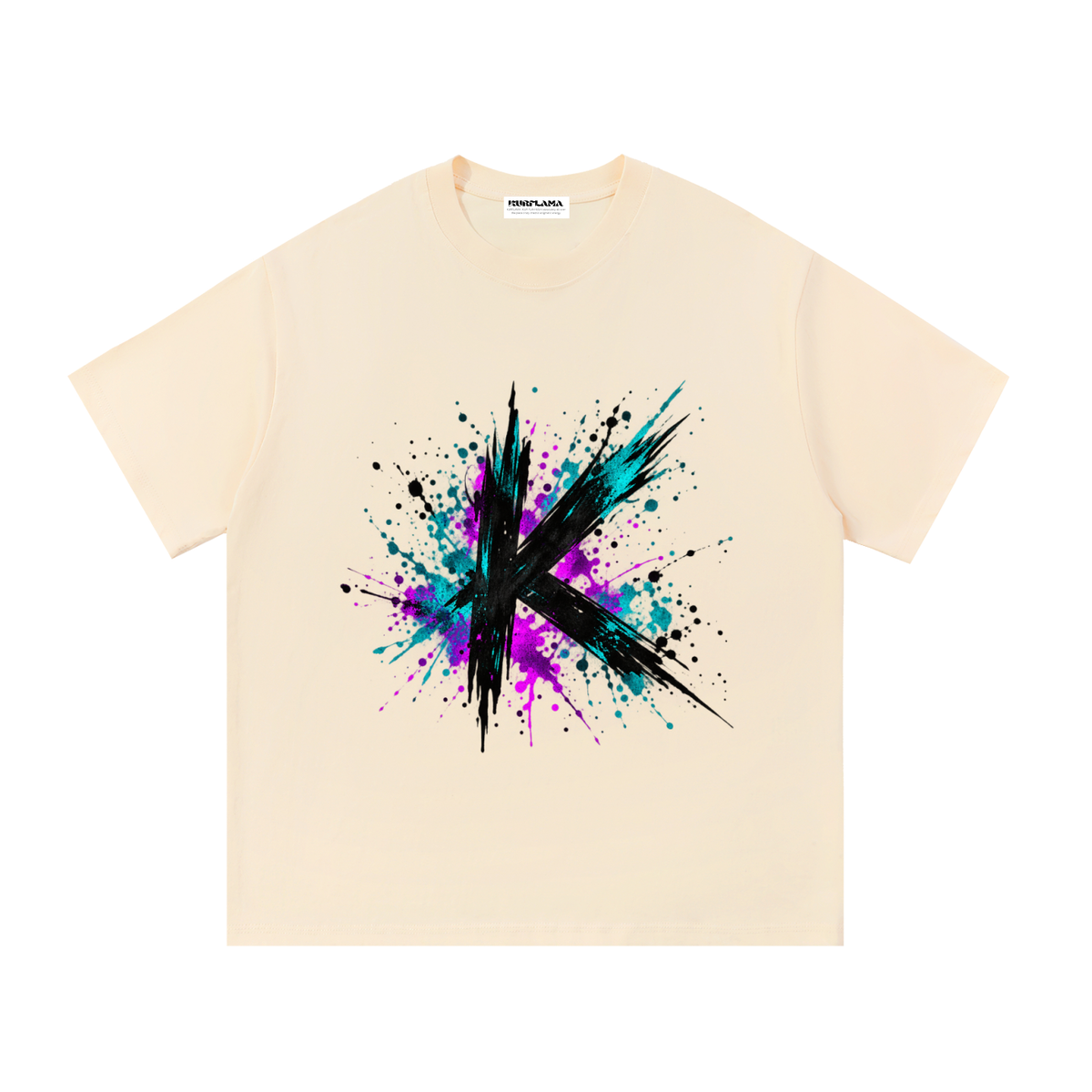 Front view of a cream tee with a black K and teal and magenta paint splashes.