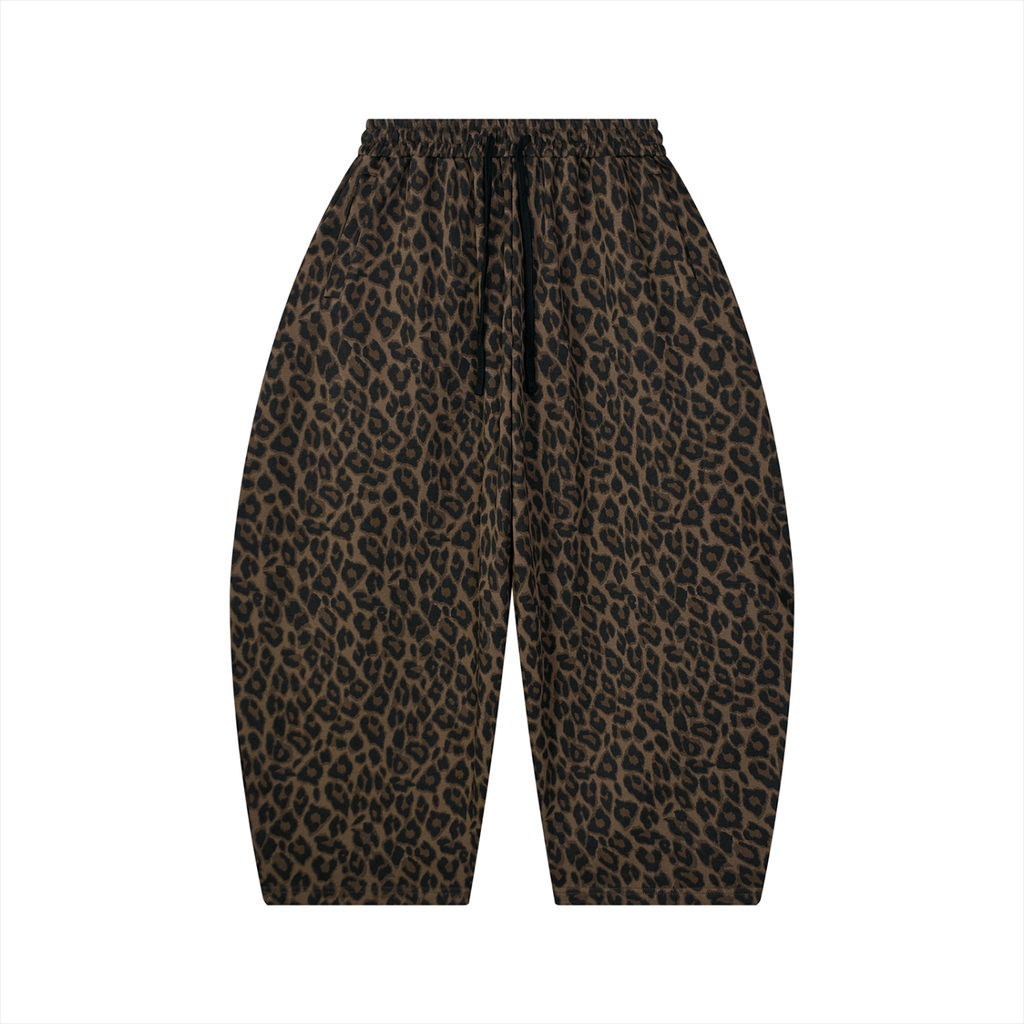 Leopard print wide-leg sweatpants with an elastic waistband and black drawstring, shown flat on a white background.