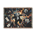 Front of a fringed woven blanket with a dark cartoon animal, skulls and colorful artwork.