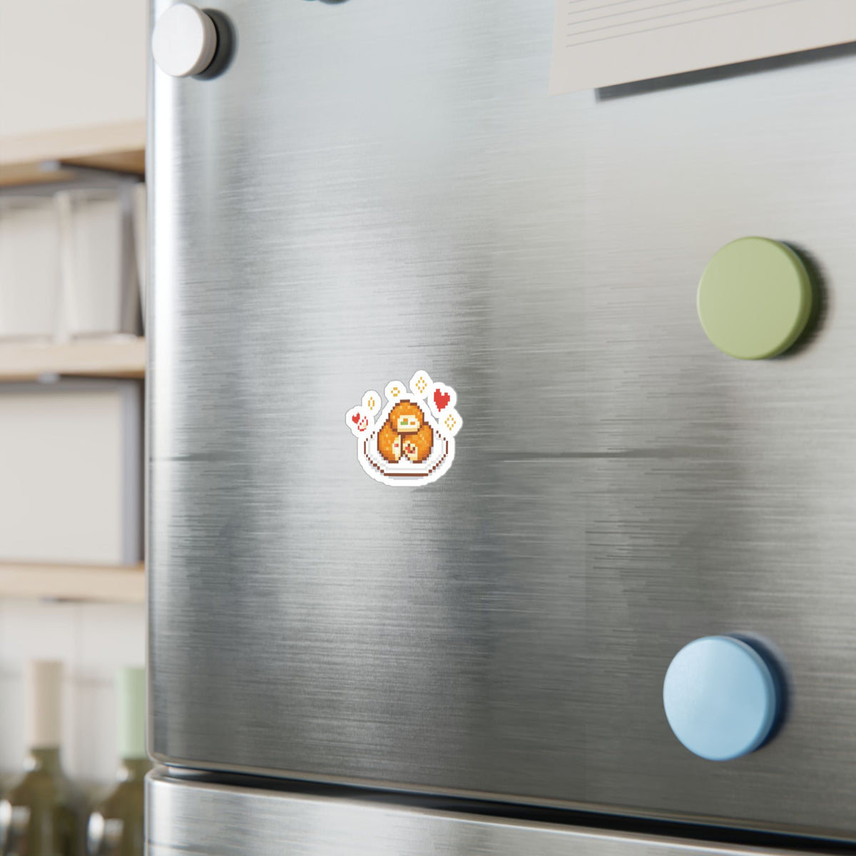 Sloth and apple-fritter sticker displayed on a refrigerator.