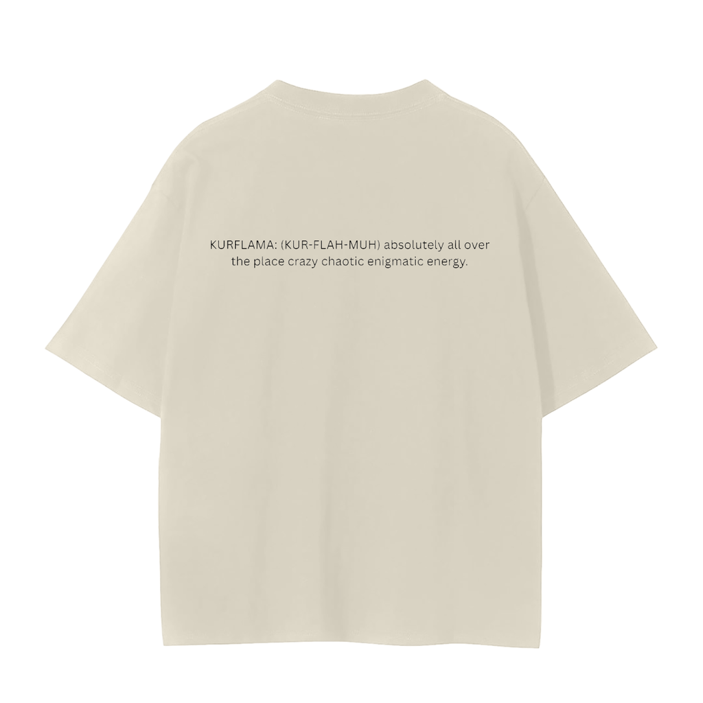 A cream-colored short-sleeve t-shirt shown from the back, featuring a black printed text graphic on the upper back that reads 'KURFLAMA; IKUR-FLASH-MUH absolutely all over the place crazy chaotic enigmatic energy.'.