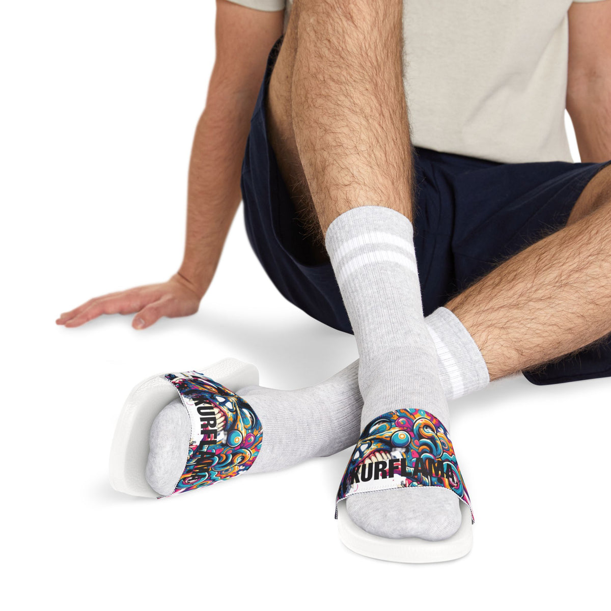 Model wearing white Kurflama graphic slides with white socks.