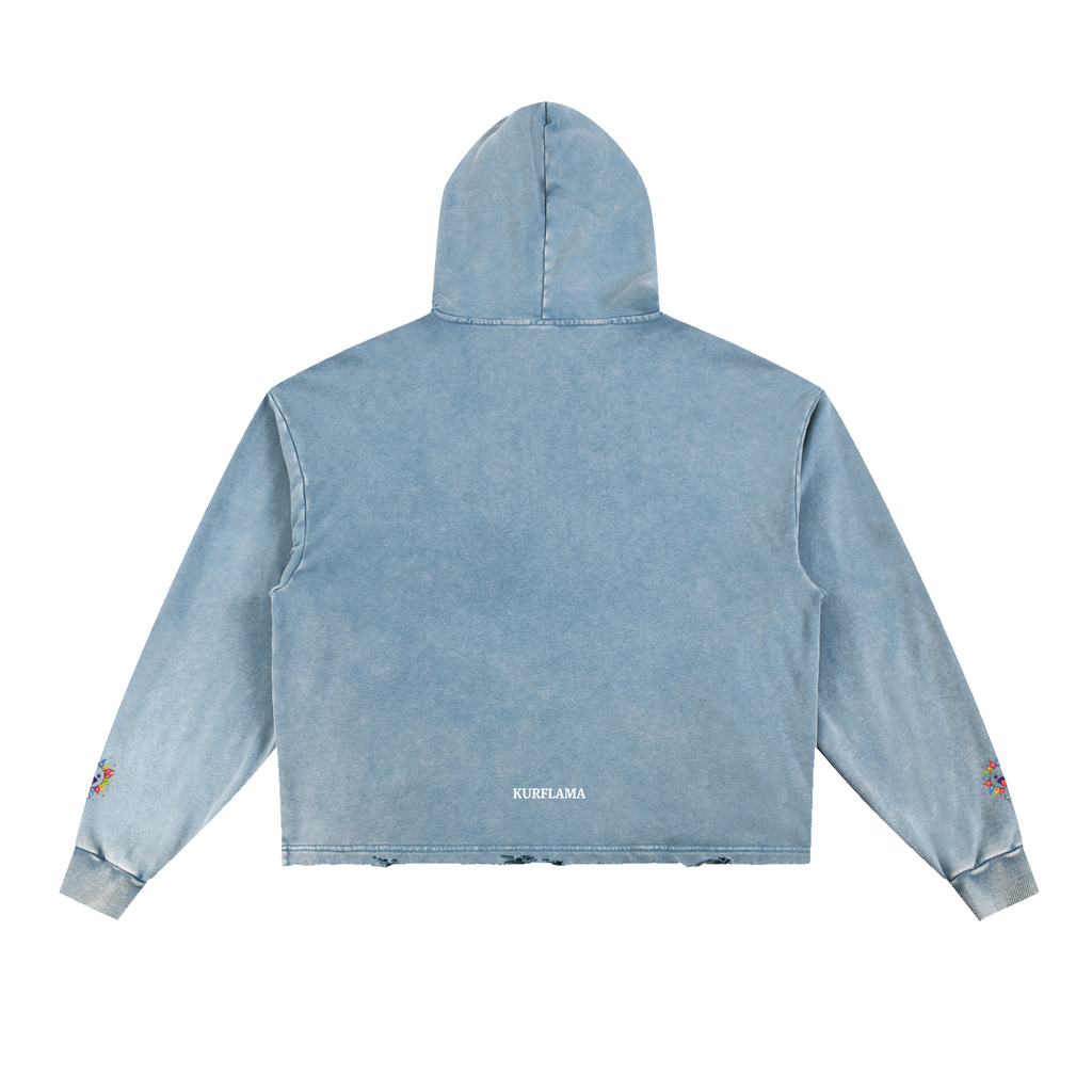 A light blue acid-wash cropped hoodie shown from the back, featuring a hood, long sleeves, and small colorful embroidered details on the cuffs, with 'KURFLAMA' printed in white near the bottom hem.