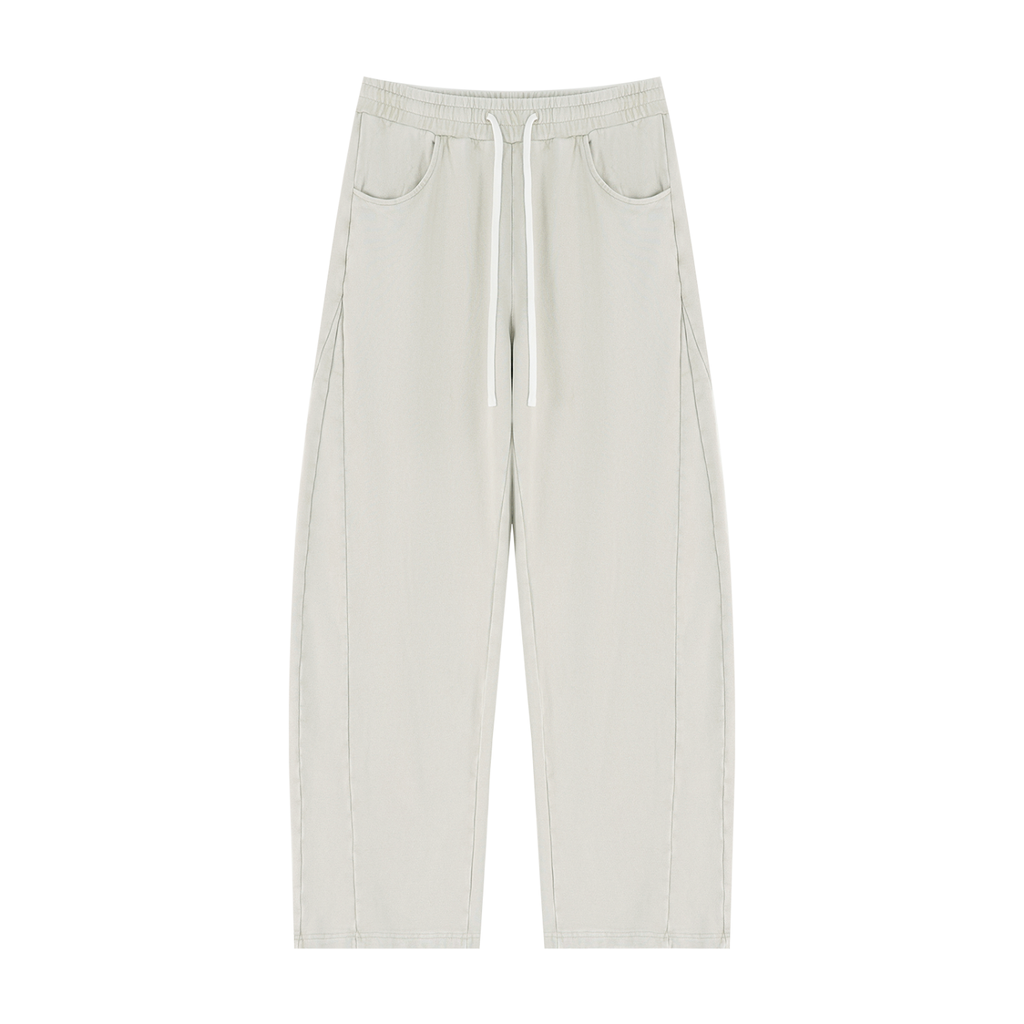 A pair of light sage green wide-leg pants with a white drawstring waist and side pockets, shown flat on a white background.